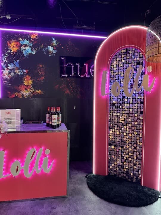 Lolli Wines pop-up brand experience with illuminated branding and hospitality seating Lolli Wines pop-up brand experience with illuminated branding and hospitality seating