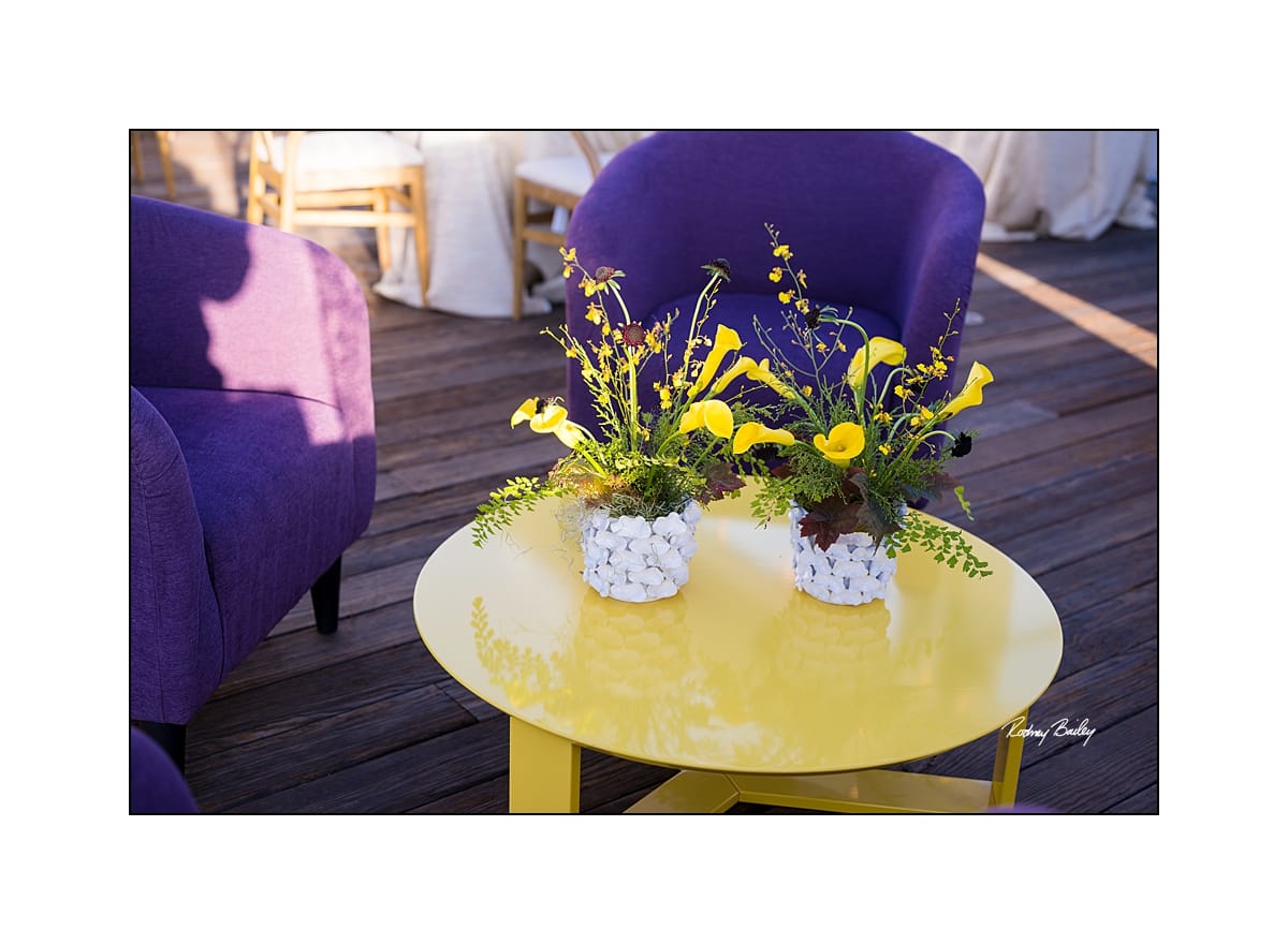Hospitality lounge clusters along a private waterfront venue
