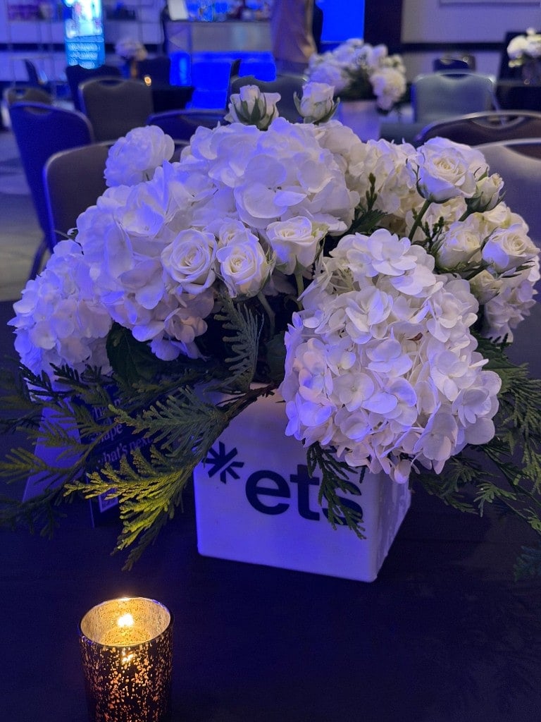 White hydrangea centerpiece in an ETS branded vase with candlelight White hydrangea centerpiece in an ETS branded vase with candlelight