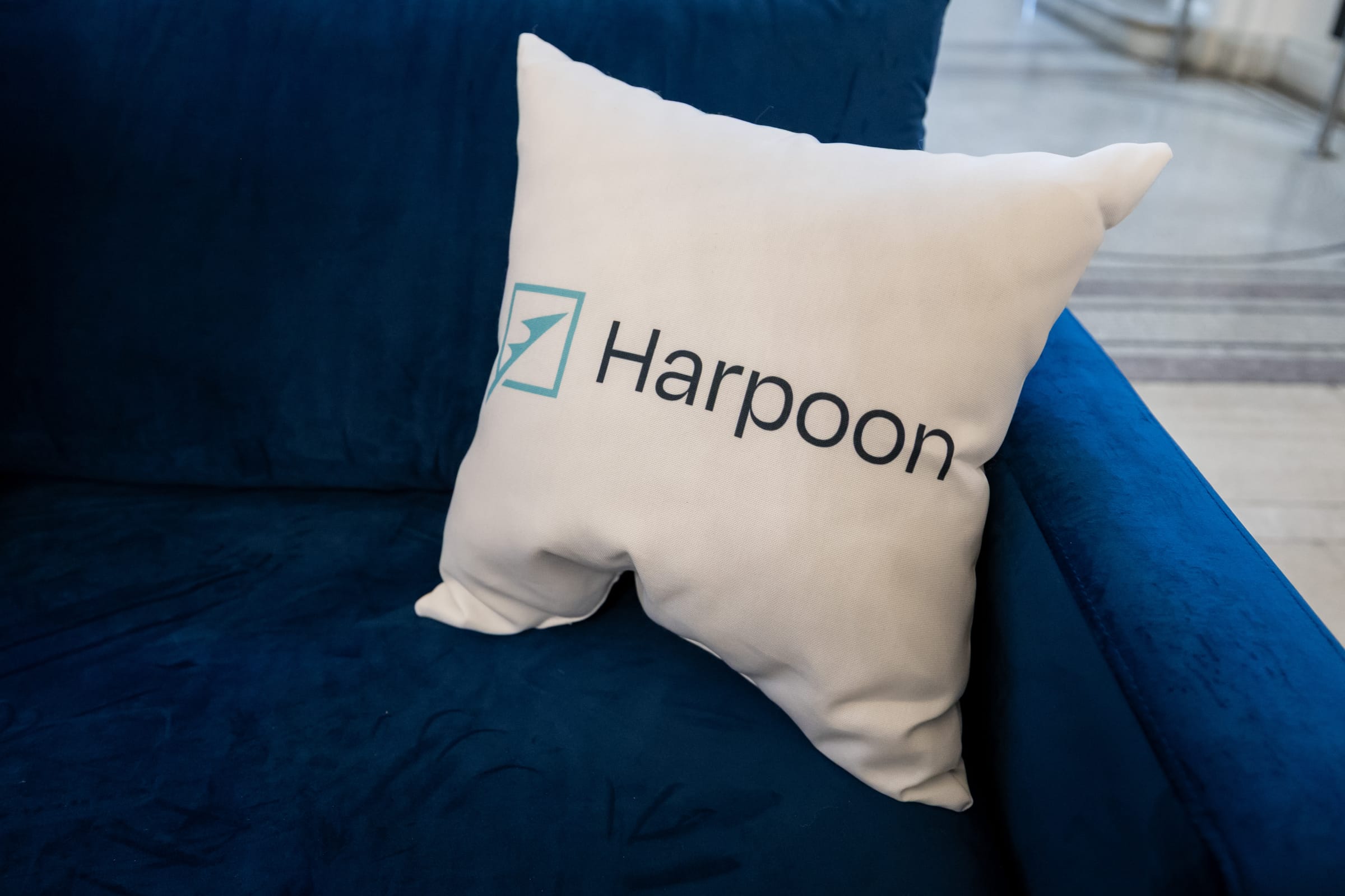 Harpoon branded pillow detail Harpoon branded pillow on a lounge sofa at the Freedom Tech Summit